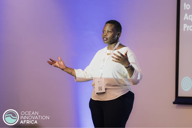 A woman giving a presentation.