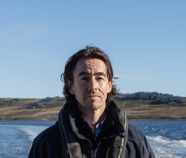 A man standing on a boat.