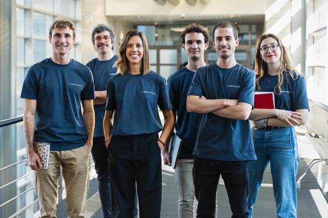 A group photo in a corridor.