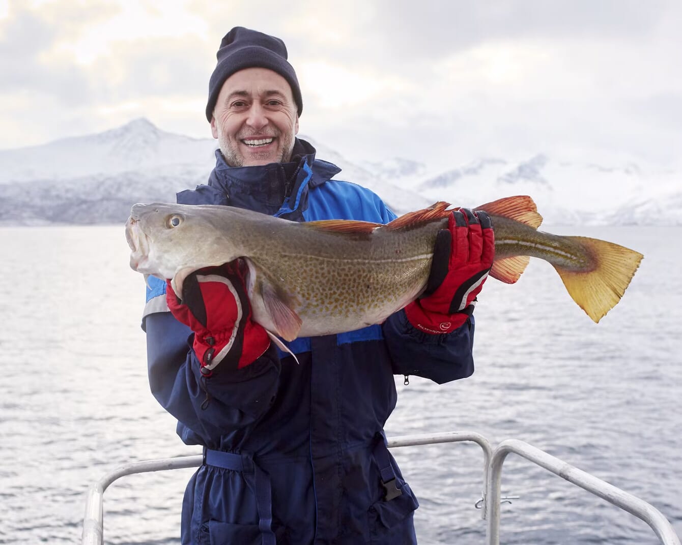 A man holding a large fish
