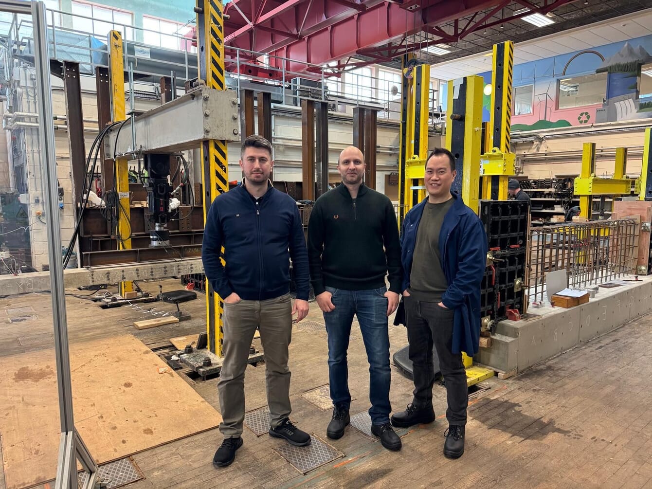 Three men in a factory.