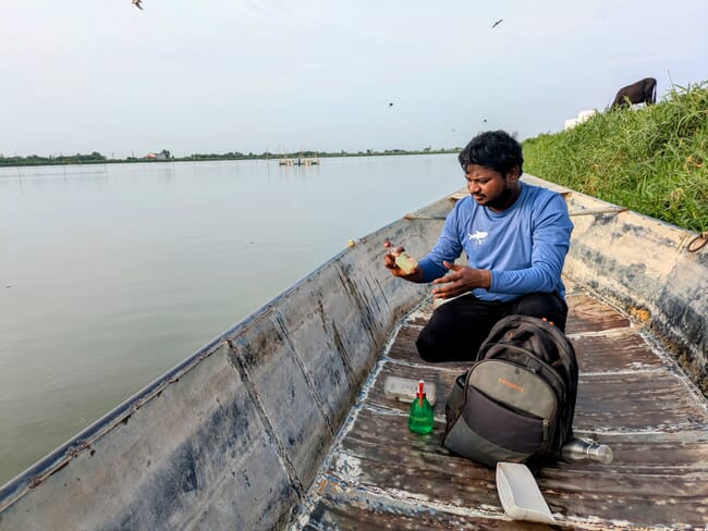 A man in a wooden boat.