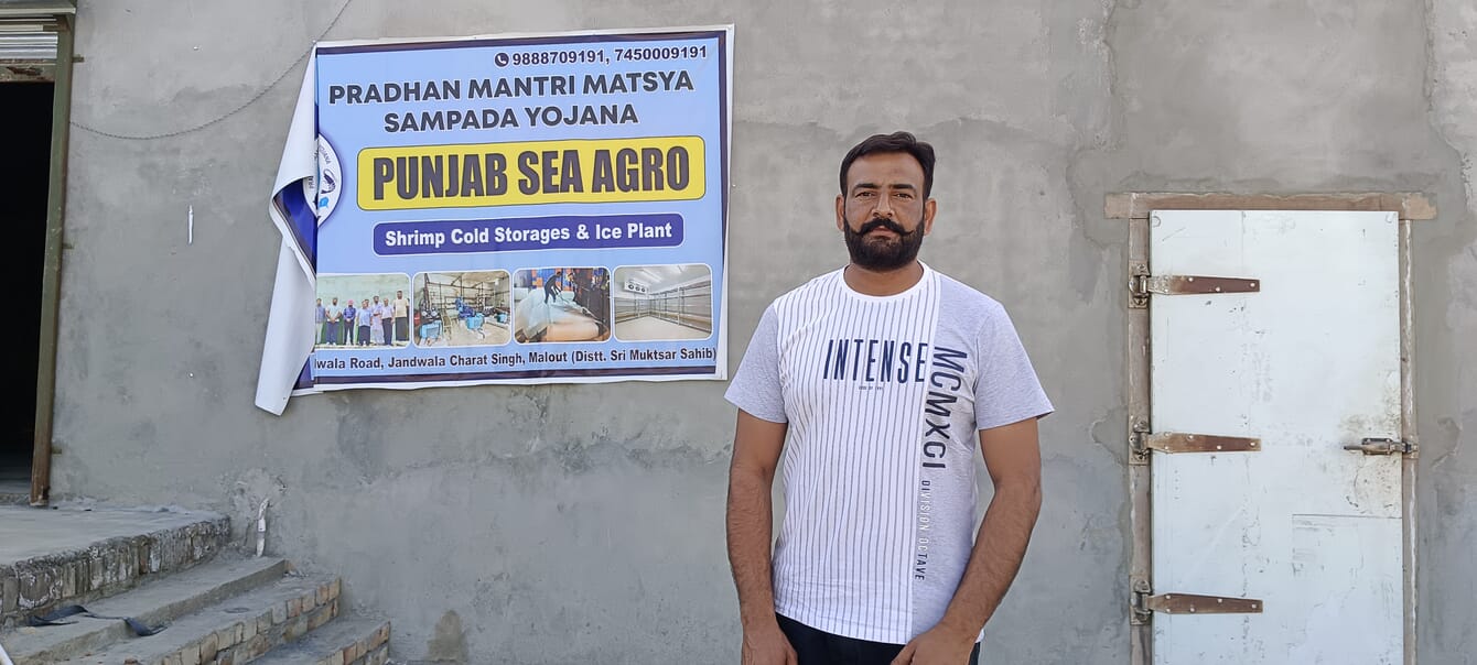 A man standing in front of a wall.