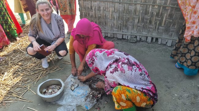 Women at work in a courtyard.