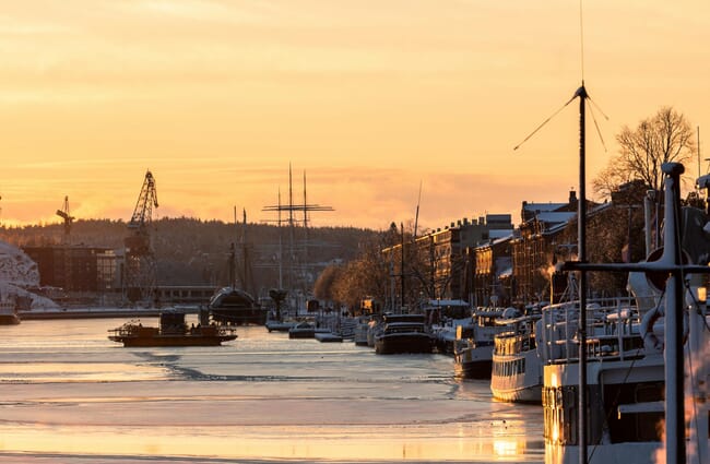A port of a city at sunset.