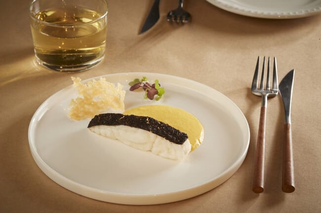 A cultivated fish fillet in a plate.