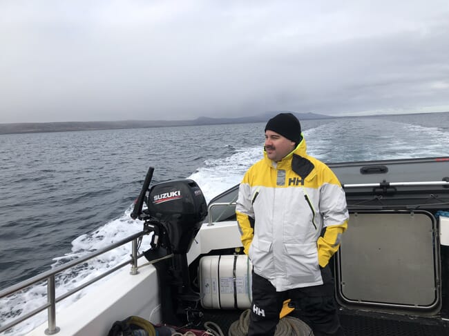 A man standing on a boat.