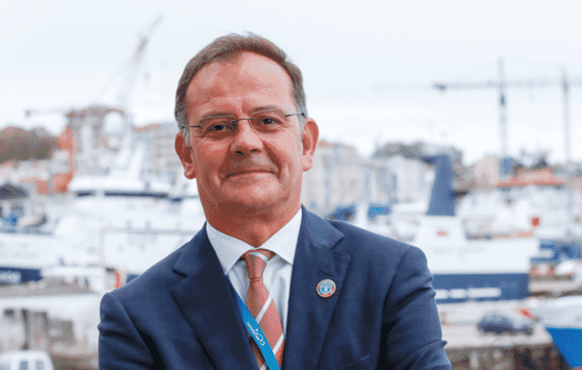 Headshot of a man in a suit.