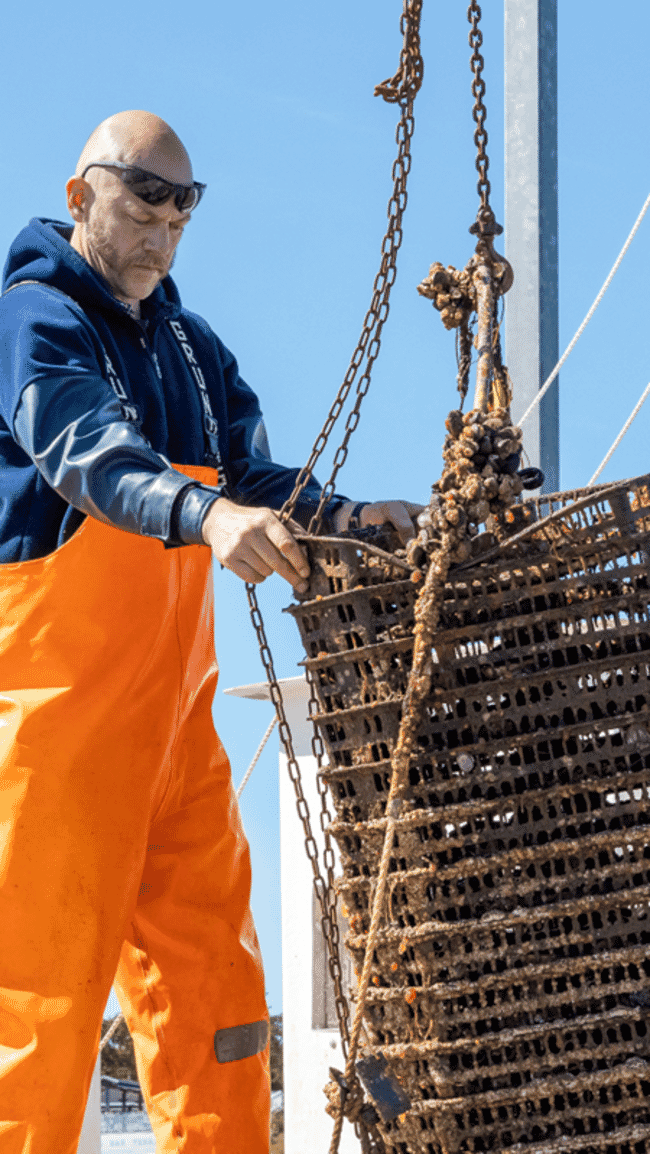 A man holding a large container.